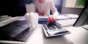 woman lawyer calculating tax for dentistry