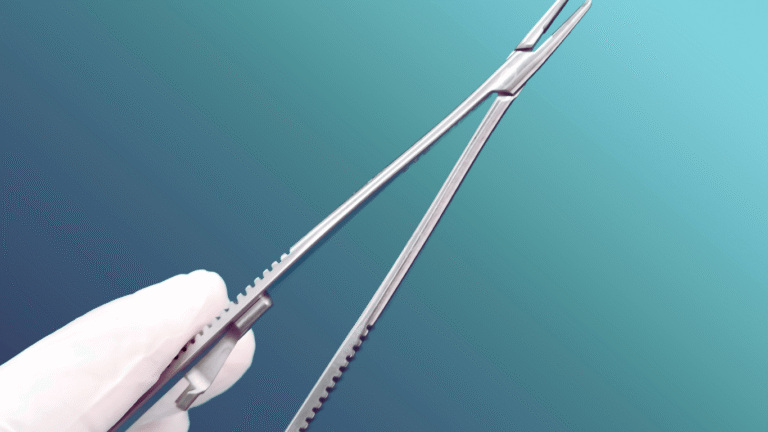 Castroviejo needle holder micro-scissors held in a gloved hand.