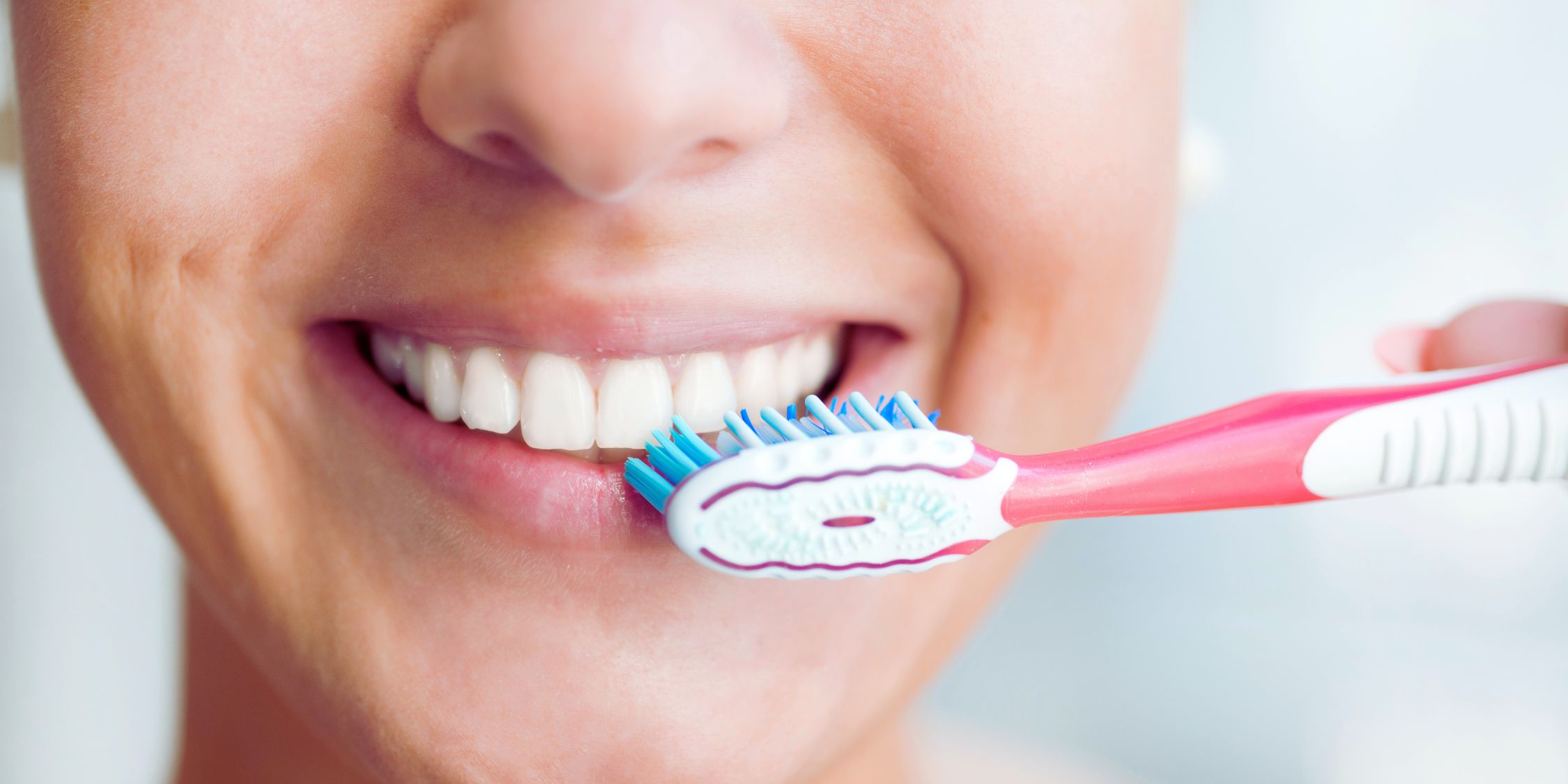 Dentist treating patient while explaining oral systemic health